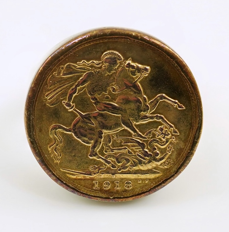 A George V 1918 gold sovereign, in a 9ct gold ring mount